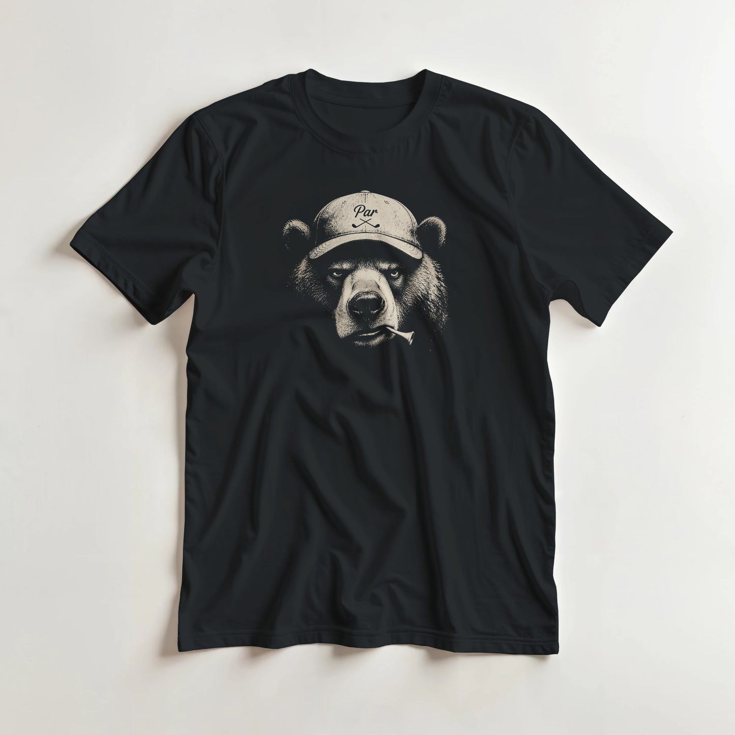Bear Golfer T-Shirt in Black lying on a plain floor. T-shirt is a unisex cut and 100 per cent cotton.