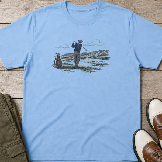 Brave Shot T-Shirt in Light Blue lying on a plain floor. T-shirt is a unisex cut and 100 per cent cotton.