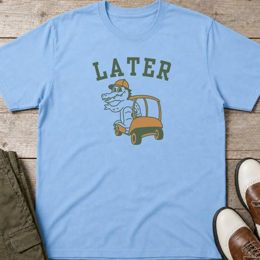 Later Gator T-Shirt in Light Blue lying on a plain floor. T-shirt is a unisex cut and 100 per cent cotton.