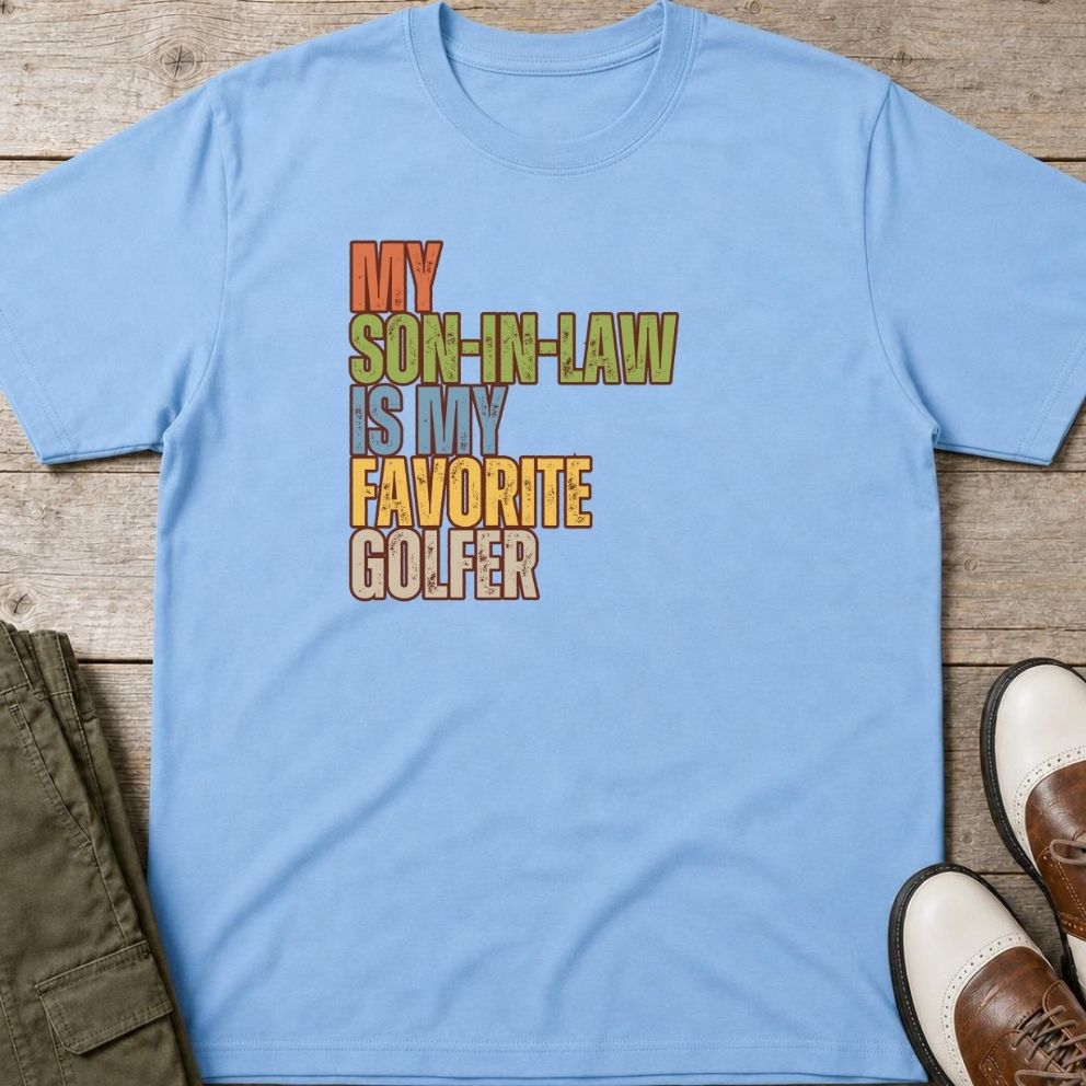 Son-In-Law T-Shirt in Light Blue lying on a plain floor. T-shirt is a unisex cut and 100 per cent cotton.