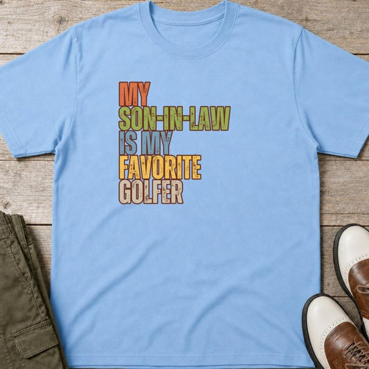Son-In-Law T-Shirt in Light Blue lying on a plain floor. T-shirt is a unisex cut and 100 per cent cotton.