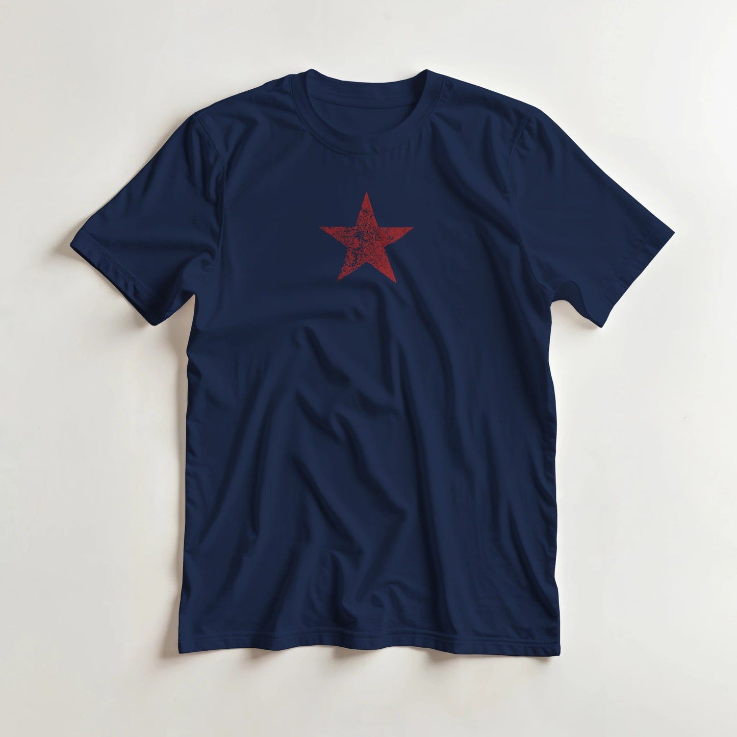 Star Rouge T-Shirt in Navy lying on a plain floor. T-shirt is a unisex cut and 100 per cent cotton.