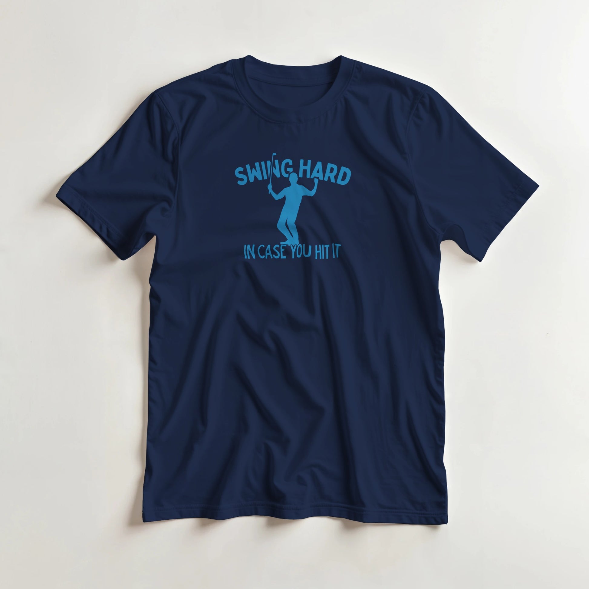 Swing Hard T-Shirt in Navy lying on a plain floor. T-shirt is a unisex cut and 100 per cent cotton.