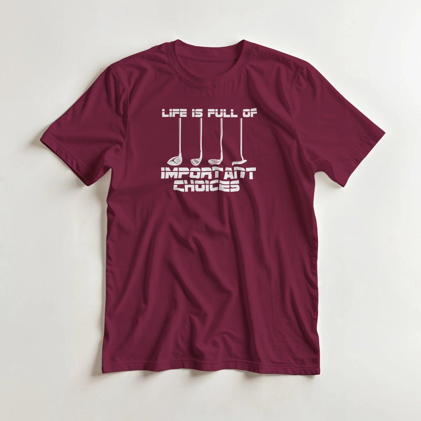 Important Choices T-Shirt in Maroon lying on a plain floor. T-shirt is a unisex cut and 100 per cent cotton.