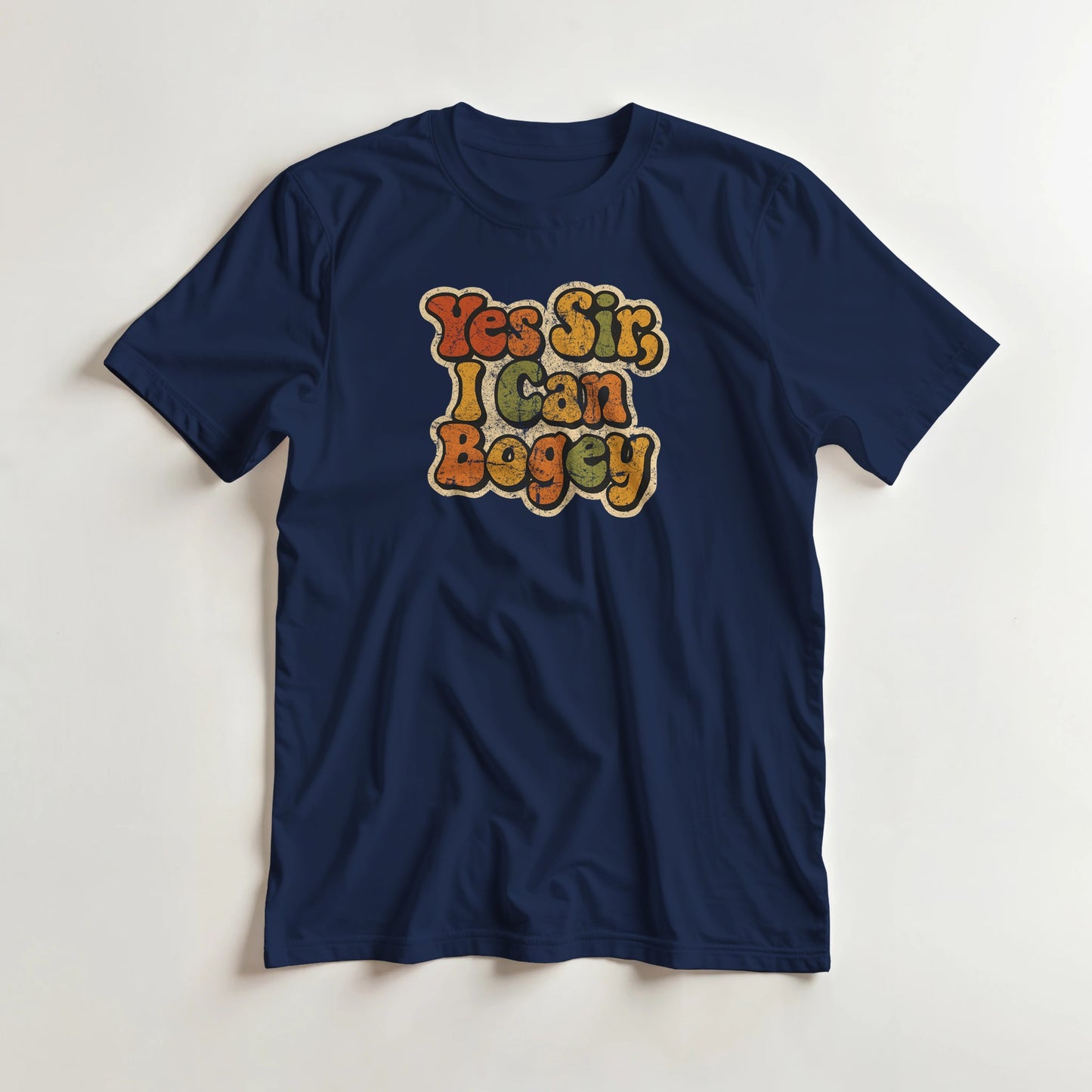 I Can Bogey T-Shirt in Navy L lying on a plain floor. T-shirt is a unisex cut and 100 per cent cotton.