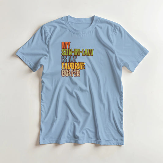 Son-In-Law T-Shirt in Light Blue lying on a plain floor. T-shirt is a unisex cut and 100 per cent cotton.