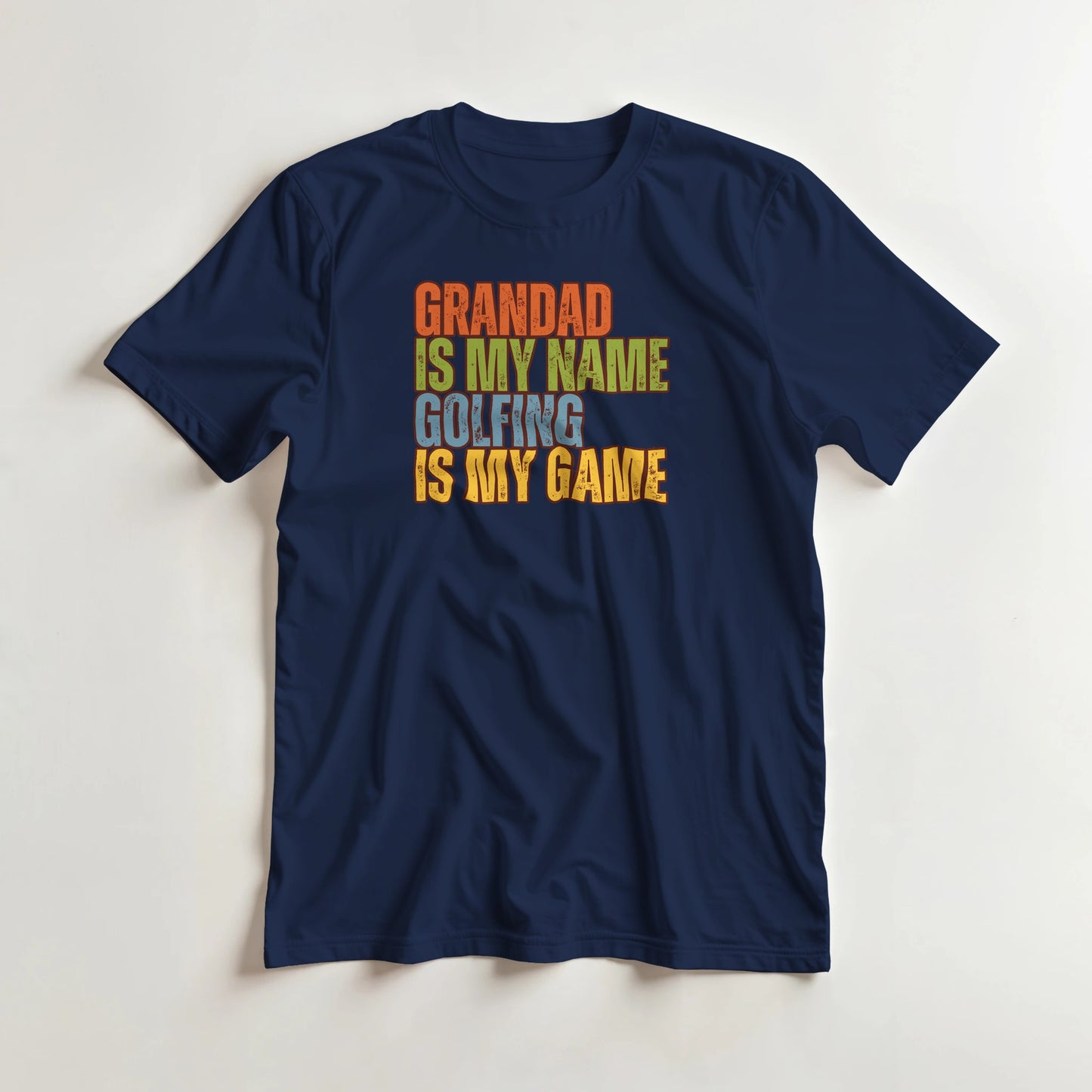 Grandad Golfing T-Shirt in Navy 3XL lying on a plain floor. T-shirt is a unisex cut and 100 per cent cotton.
