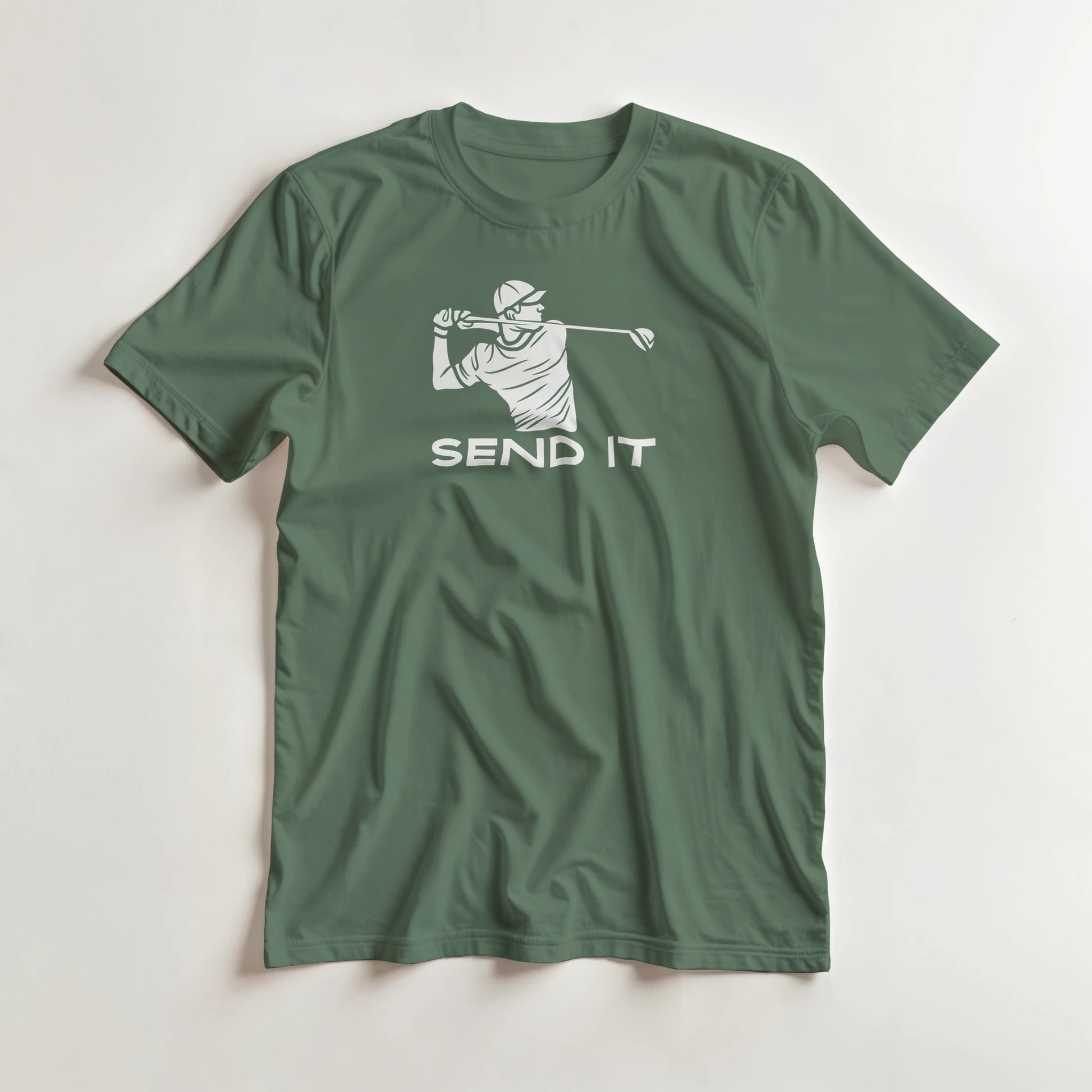 Send It T-Shirt in Military Green S lying on a plain floor. T-shirt is a unisex cut and 100 per cent cotton.