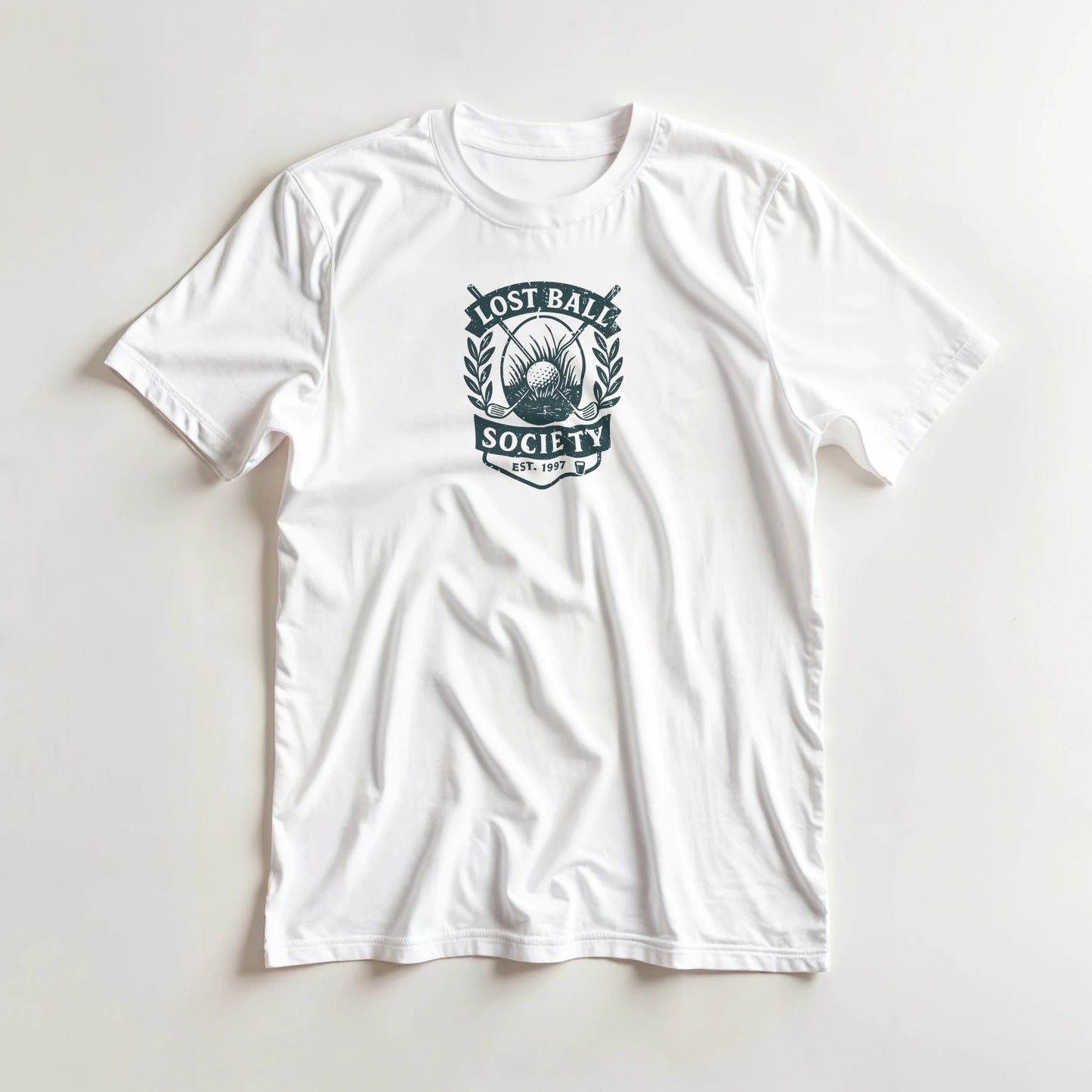 Lost Ball Society T-Shirt in White S lying on a plain floor. T-shirt is a unisex cut and 100 per cent cotton.