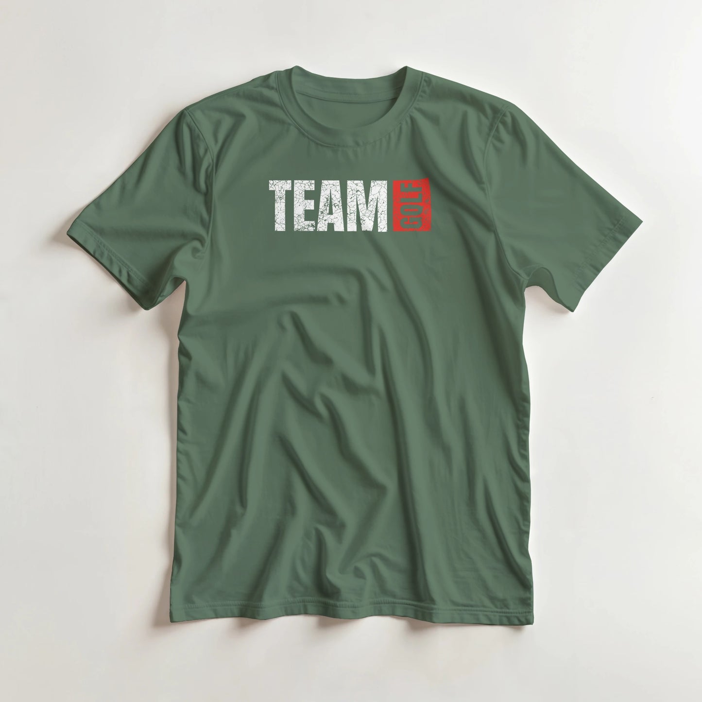Team Golf T-Shirt in Military Green lying on a plain floor. T-shirt is a unisex cut and 100 per cent cotton.