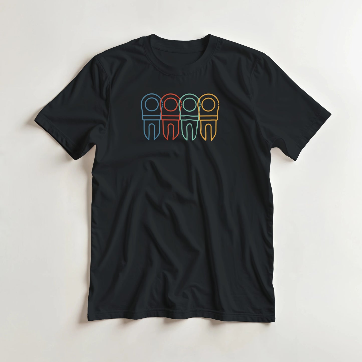 Divot Rainbow T-Shirt in Black S lying on a plain floor. T-shirt is a unisex cut and 100 per cent cotton.