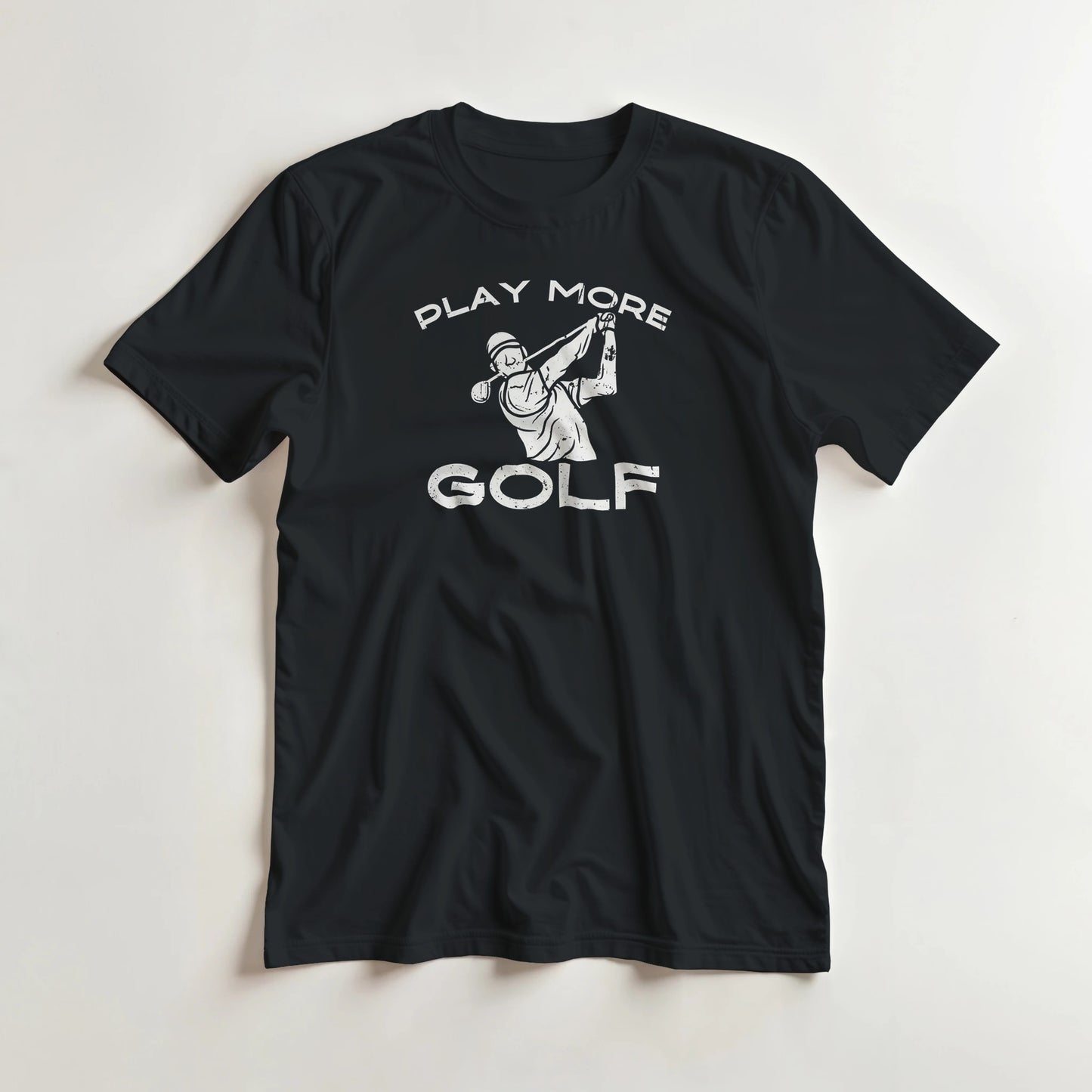 Play More Golf T-Shirt in Black 2XL lying on a plain floor. T-shirt is a unisex cut and 100 per cent cotton.