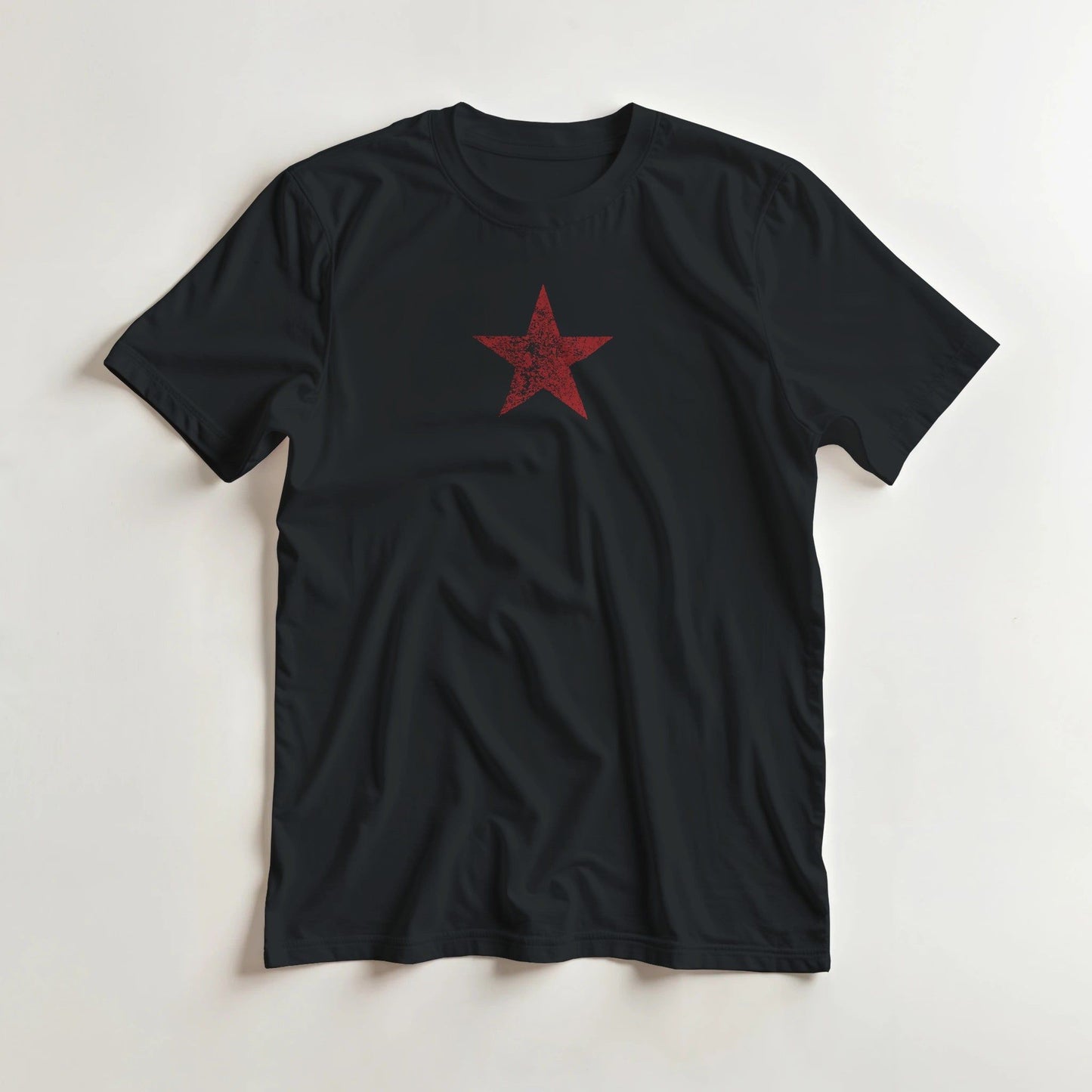 Star Rouge T-Shirt in Black lying on a plain floor. T-shirt is a unisex cut and 100 per cent cotton.
