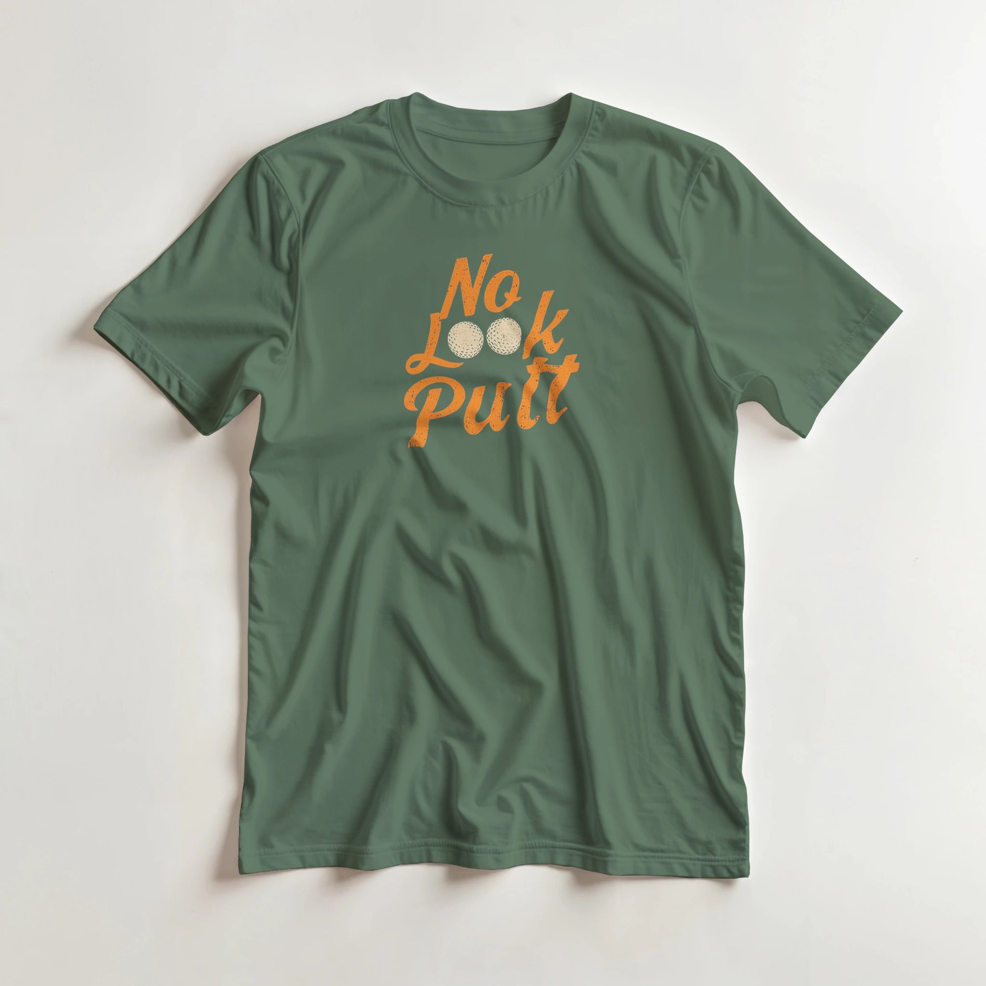 No Look T-Shirt in Military Green lying on a plain floor. T-shirt is a unisex cut and 100 per cent cotton.