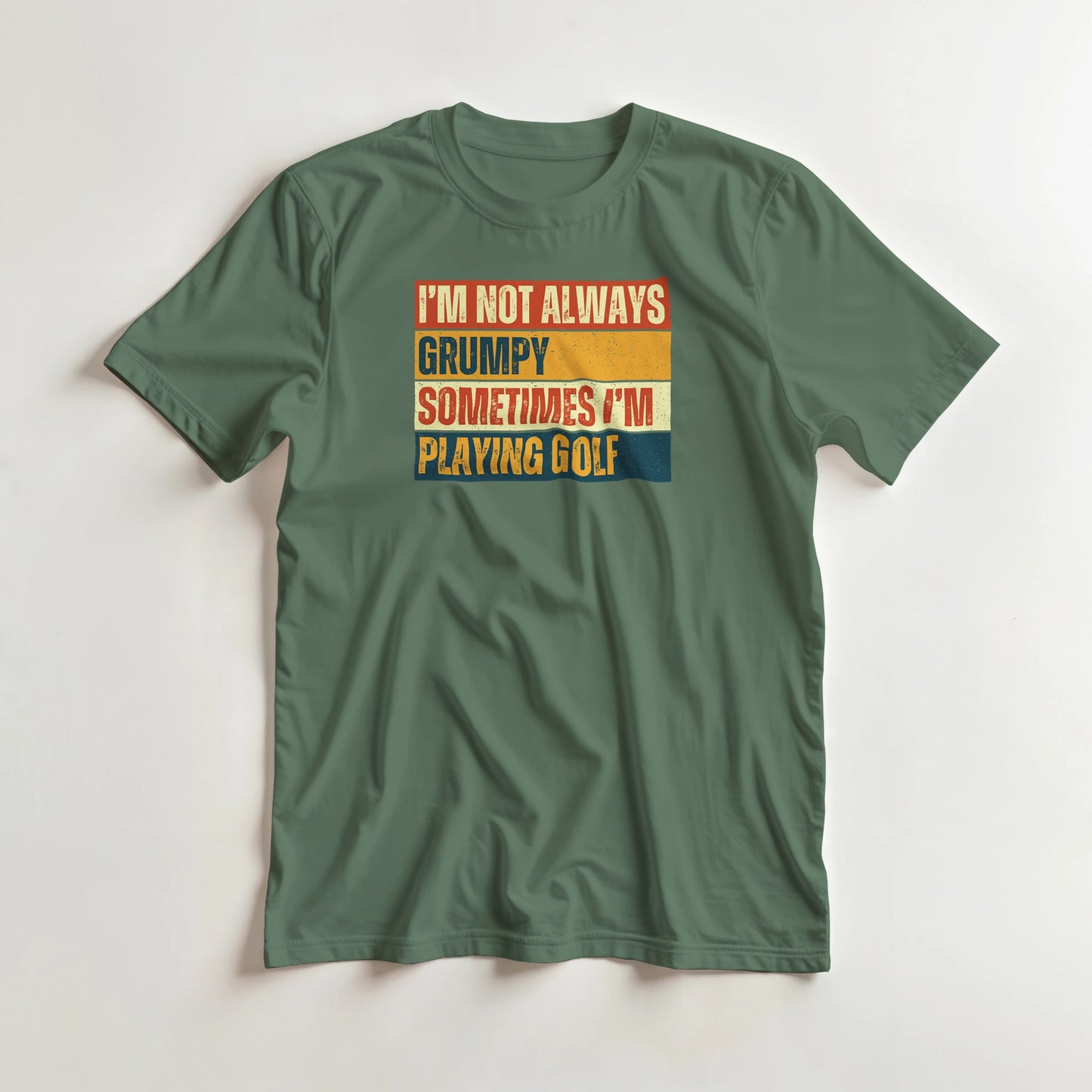 Grumpy Vintage T-Shirt in Military Green lying on a plain floor. T-shirt is a unisex cut and 100 per cent cotton.