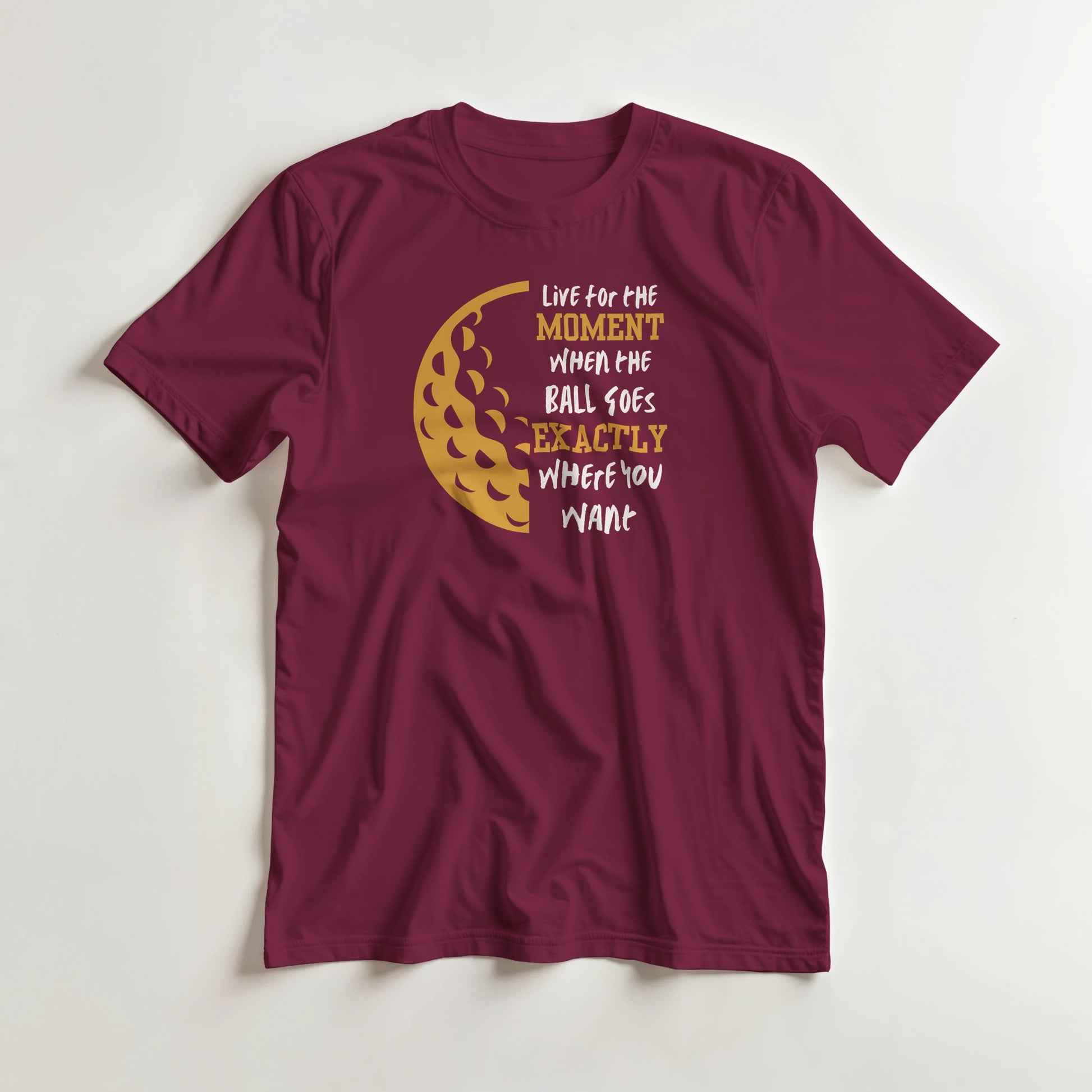 The Moment T-Shirt in Maroon lying on a plain floor. T-shirt is a unisex cut and 100 per cent cotton.