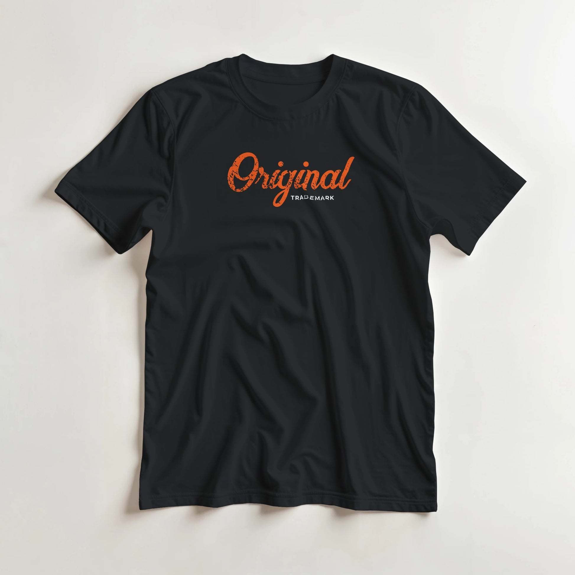 Original T-Shirt in Black S lying on a plain floor. T-shirt is a unisex cut and 100 per cent cotton.