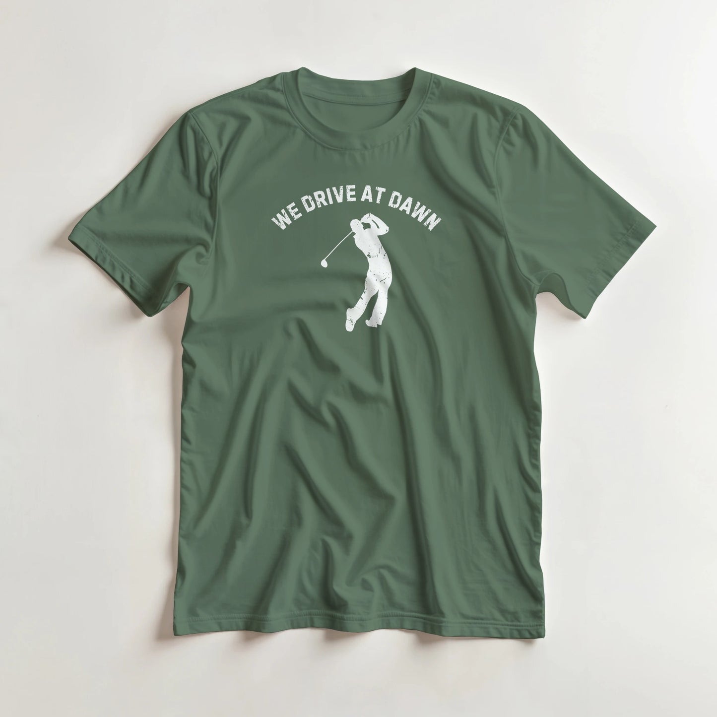 We Drive T-Shirt in Military Green 2XL lying on a plain floor. T-shirt is a unisex cut and 100 per cent cotton.