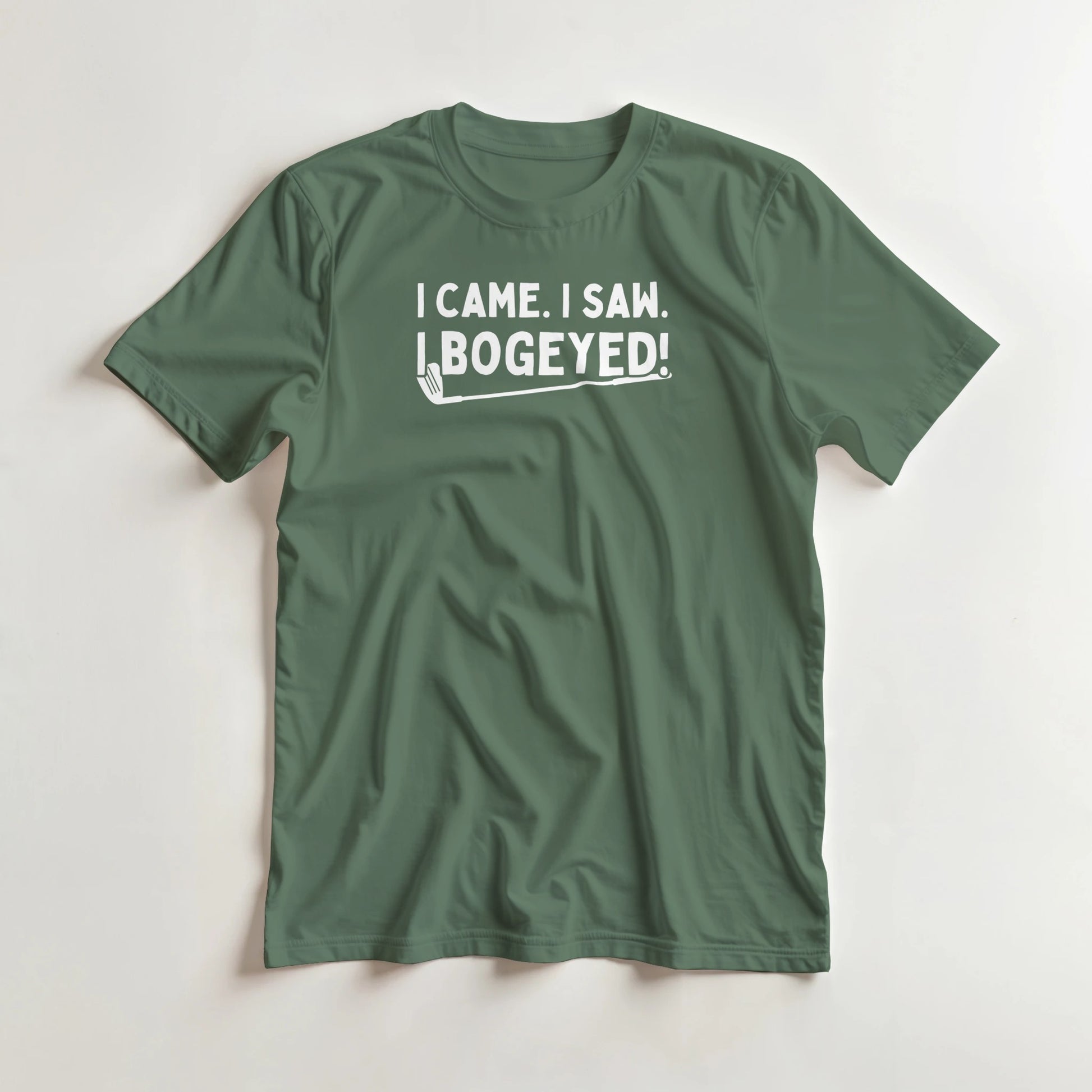 Bogeyed T-Shirt in Military Green lying on a plain floor. T-shirt is a unisex cut and 100 per cent cotton.