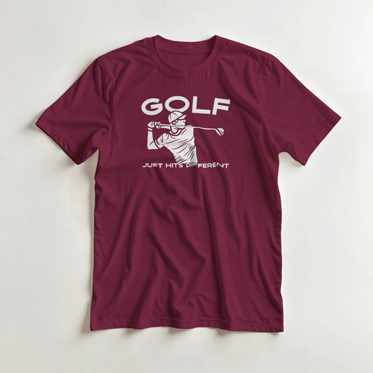 Hits Different T-Shirt in Maroon S lying on a plain floor. T-shirt is a unisex cut and 100 per cent cotton.