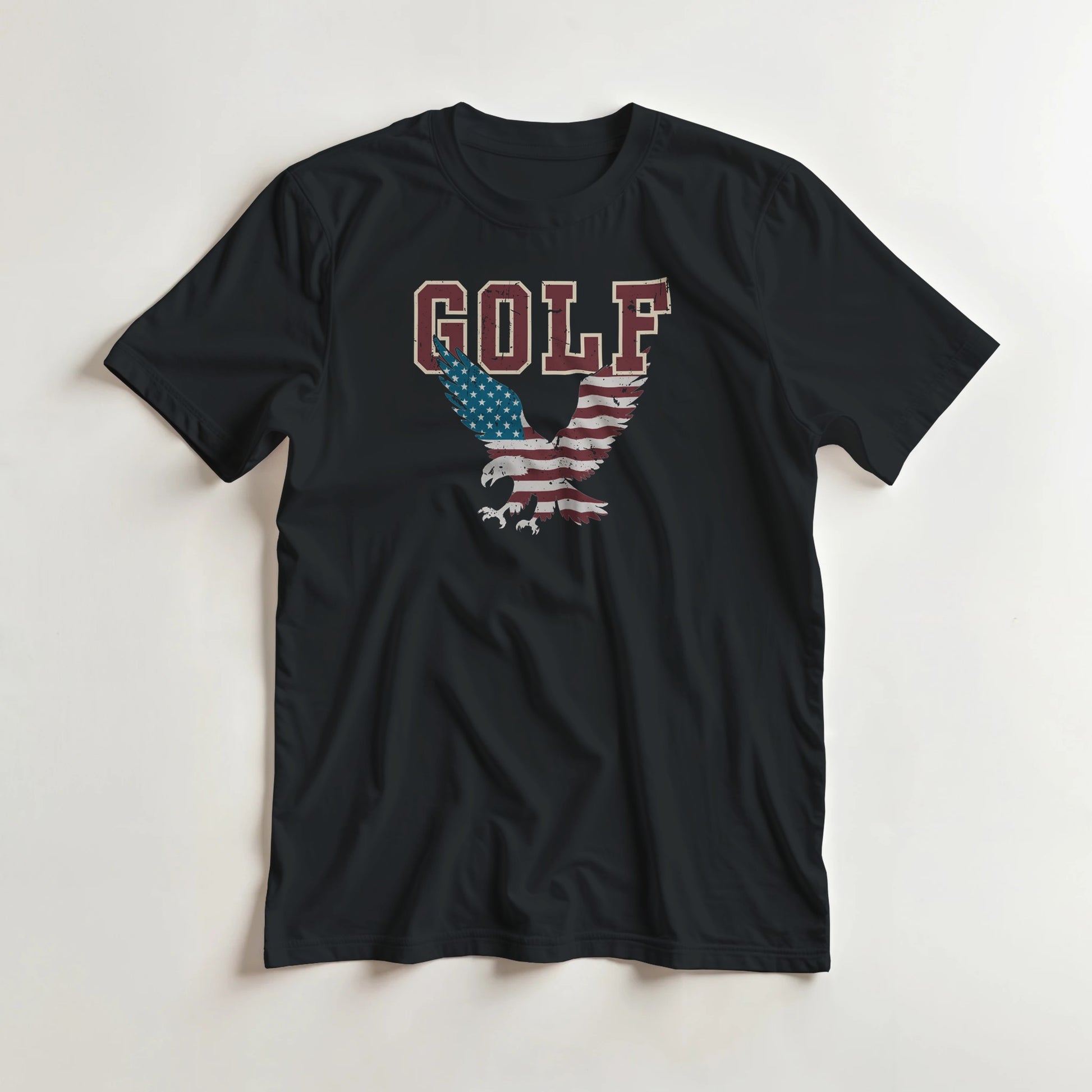 Golf USA Eagle T-Shirt in Black lying on a plain floor. T-shirt is a unisex cut and 100 per cent cotton.