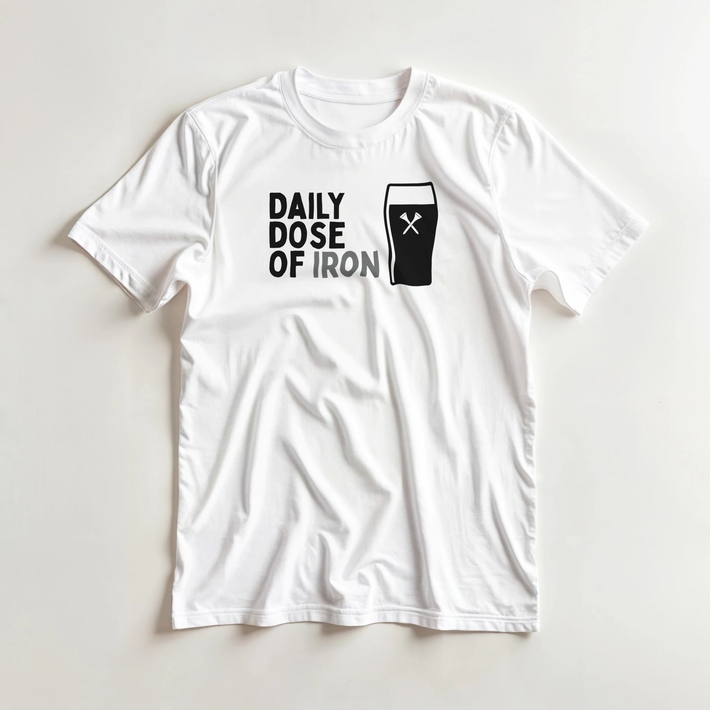 Dose Of Iron T-Shirt in White lying on a plain floor. T-shirt is a unisex cut and 100 per cent cotton.