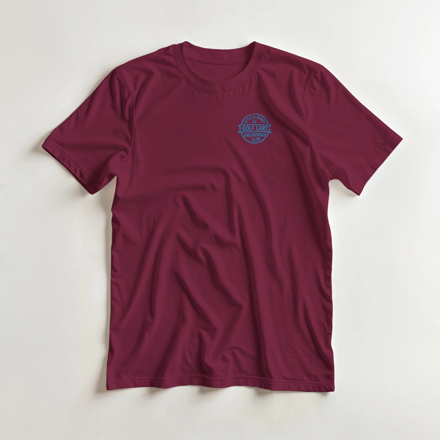 Philosophers T-Shirt in Maroon XL lying on a plain floor. T-shirt is a unisex cut and 100 per cent cotton.