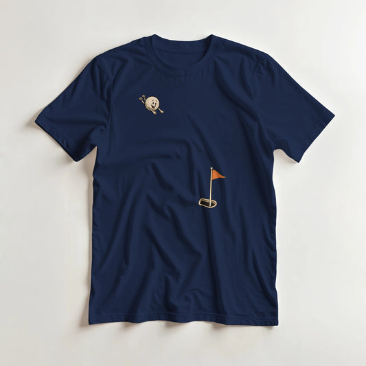 Flying Golf Ball T-Shirt in Navy lying on a plain floor. T-shirt is a unisex cut and 100 per cent cotton.