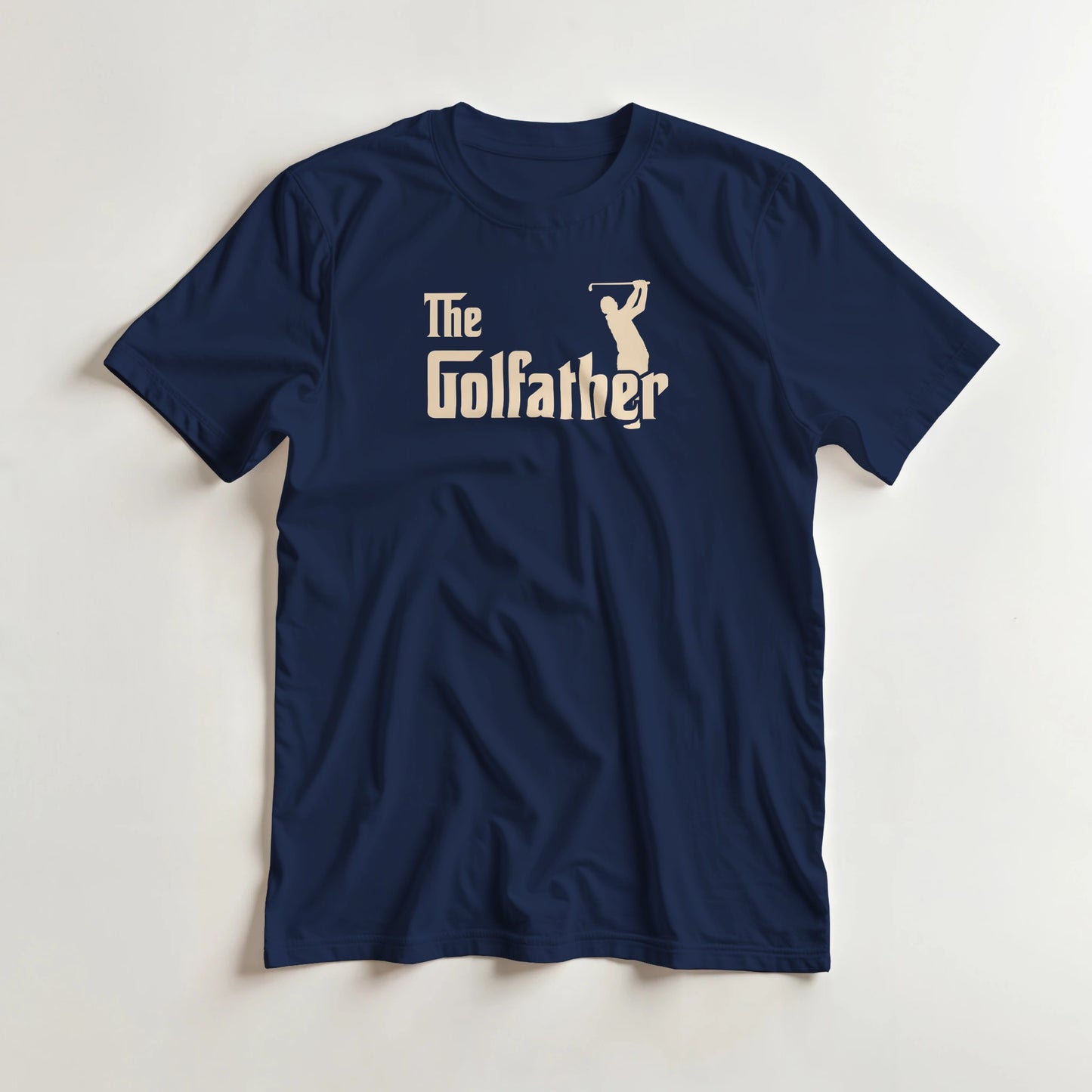 Golfather T-Shirt in Navy M lying on a plain floor. T-shirt is a unisex cut and 100 per cent cotton.