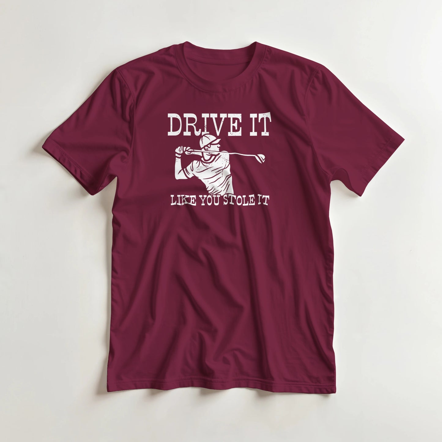 Stole It T-Shirt in Maroon lying on a plain floor. T-shirt is a unisex cut and 100 per cent cotton.