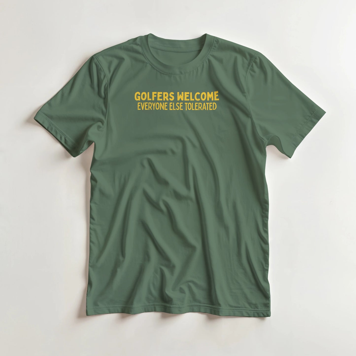 Golfers Welcome T-Shirt in Military Green lying on a plain floor. T-shirt is a unisex cut and 100 per cent cotton.