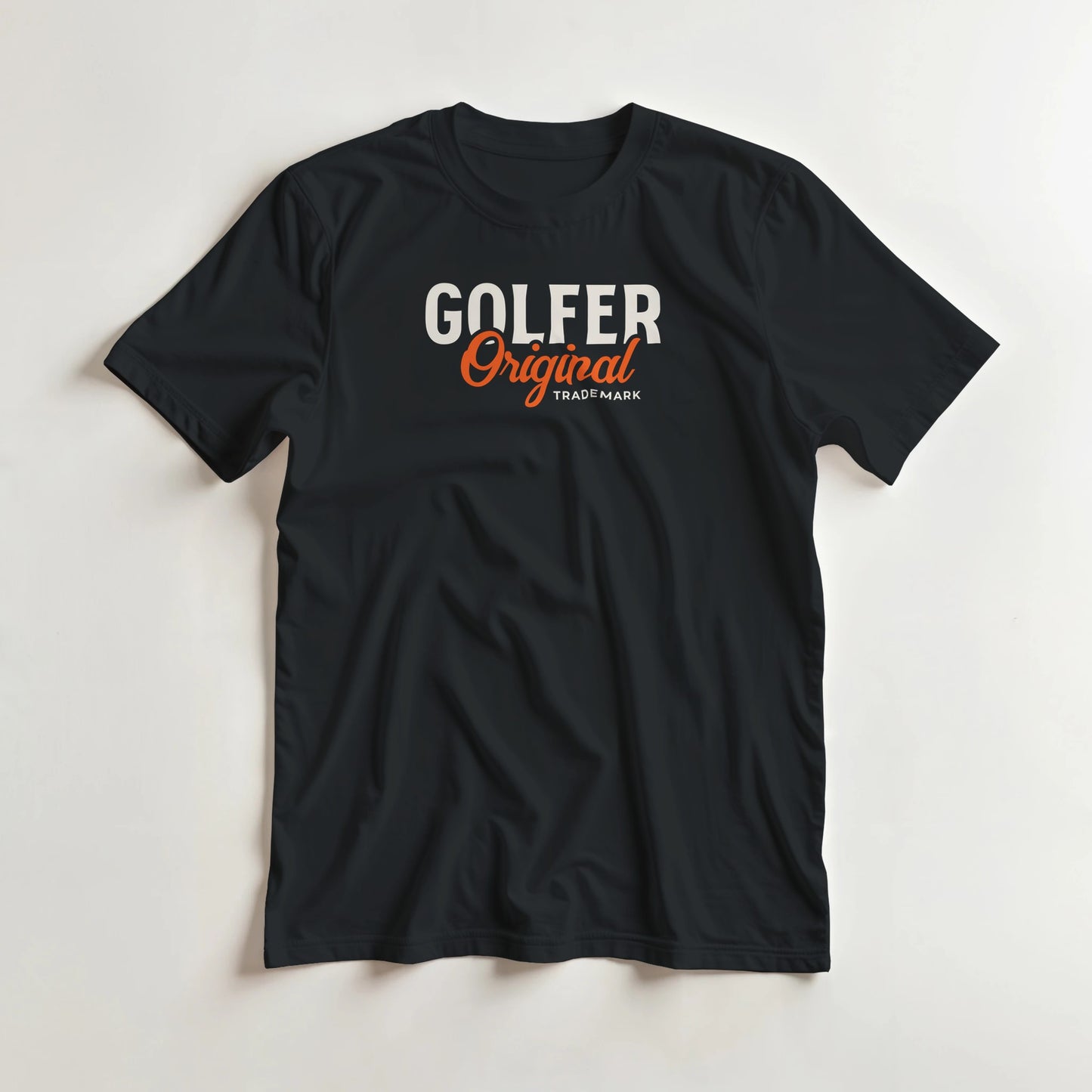 Golfer Original T-Shirt in Black lying on a plain floor. T-shirt is a unisex cut and 100 per cent cotton.