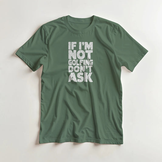 Not Golfing T-Shirt in Military Green lying on a plain floor. T-shirt is a unisex cut and 100 per cent cotton.