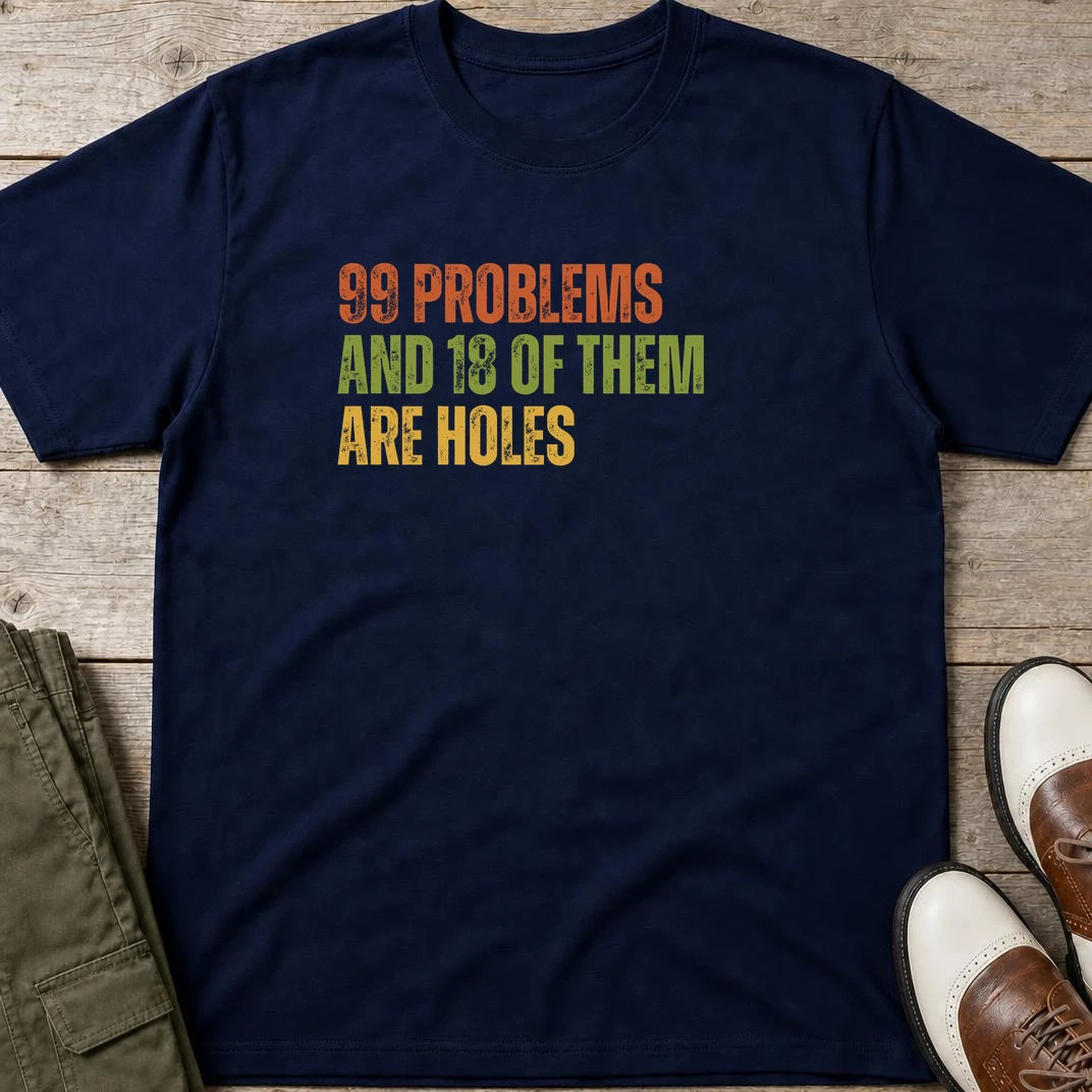 99 Problems T-Shirt in Navy lying on a plain floor. T-shirt is a unisex cut and 100 per cent cotton.