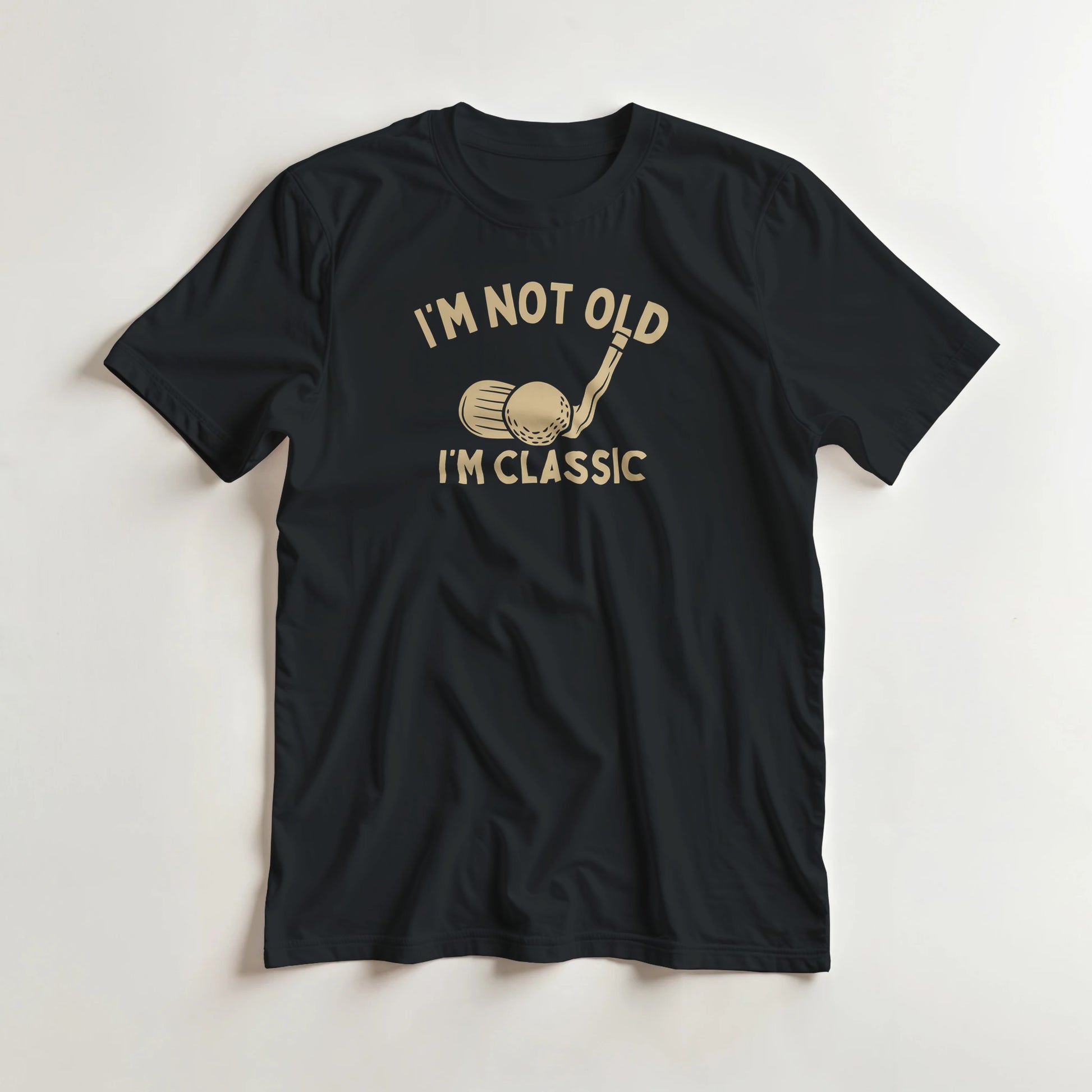 I'm Classic T-Shirt in Black lying on a plain floor. T-shirt is a unisex cut and 100 per cent cotton.