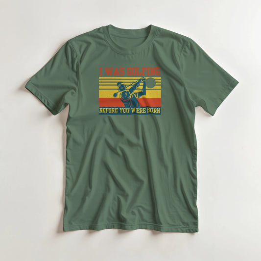 I Was Golfing T-Shirt in Military Green lying on a plain floor. T-shirt is a unisex cut and 100 per cent cotton.