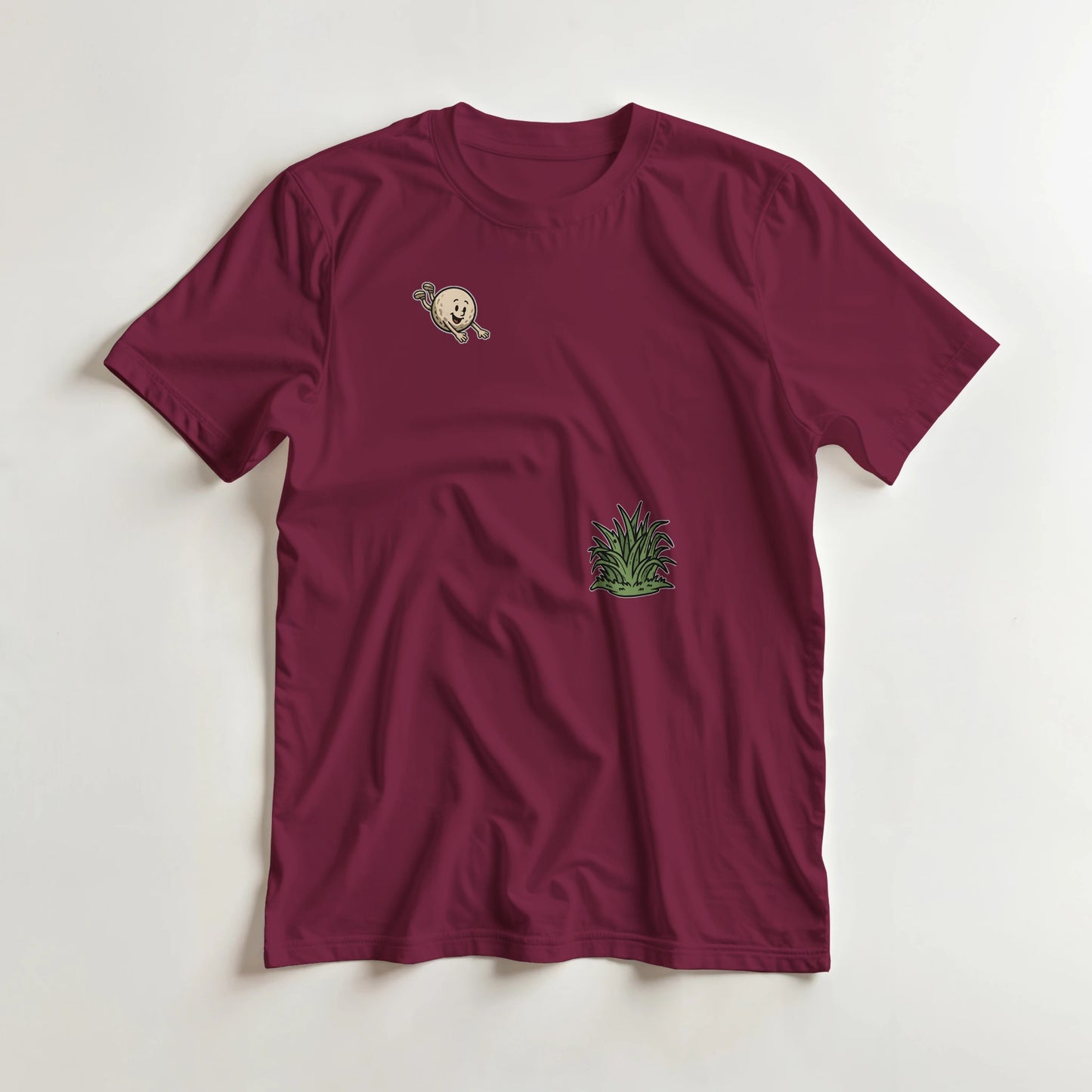 Flying Into Rough T-Shirt in Maroon lying on a plain floor. T-shirt is a unisex cut and 100 per cent cotton.