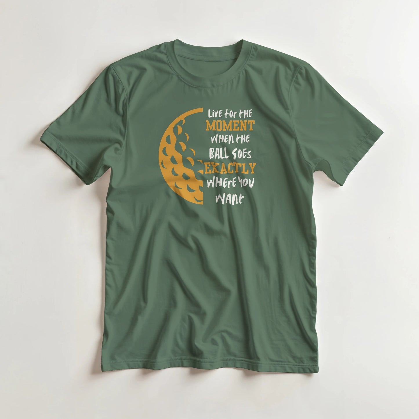 The Moment T-Shirt in Military Green lying on a plain floor. T-shirt is a unisex cut and 100 per cent cotton.