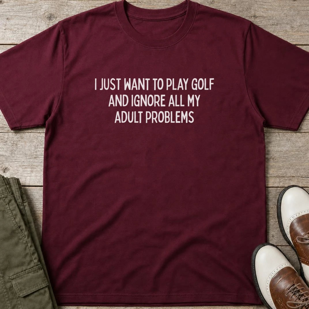 Adult Problems T-Shirt in Maroon lying on a plain floor. T-shirt is a unisex cut and 100 per cent cotton.