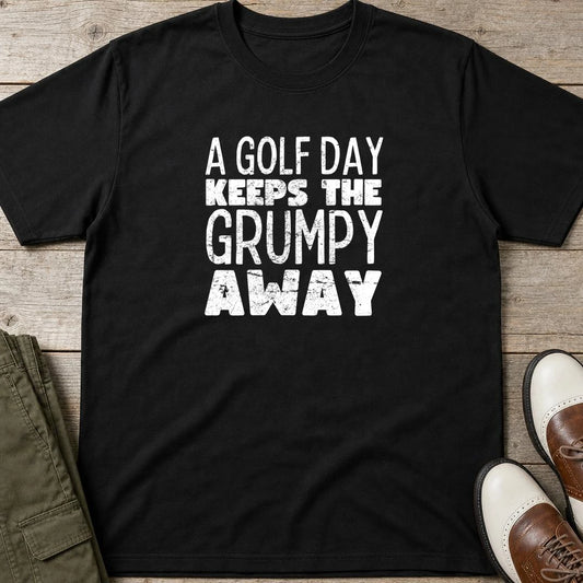 A Golf Day T-Shirt in Black lying on a plain floor. T-shirt is a unisex cut and 100 per cent cotton.