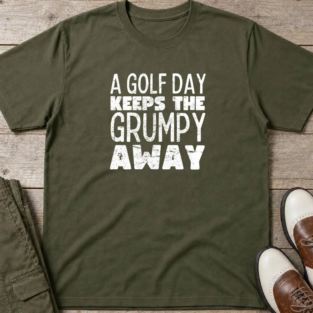 A Golf Day T-Shirt in Military Green lying on a plain floor. T-shirt is a unisex cut and 100 per cent cotton.