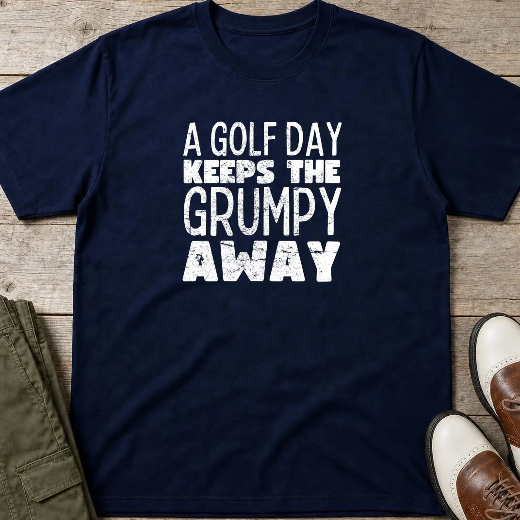 A Golf Day T-Shirt in Navy lying on a plain floor. T-shirt is a unisex cut and 100 per cent cotton.