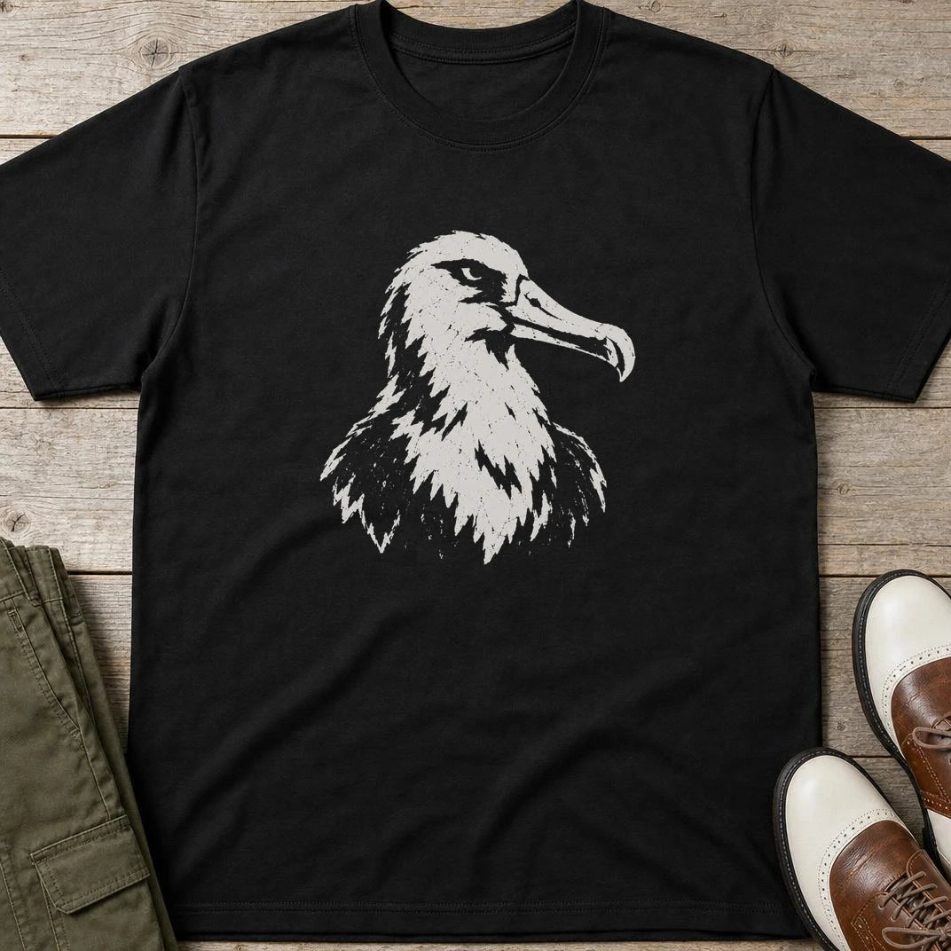 Albatross Block Print T-Shirt in Black lying on a plain floor. T-shirt is a unisex cut and 100 per cent cotton.