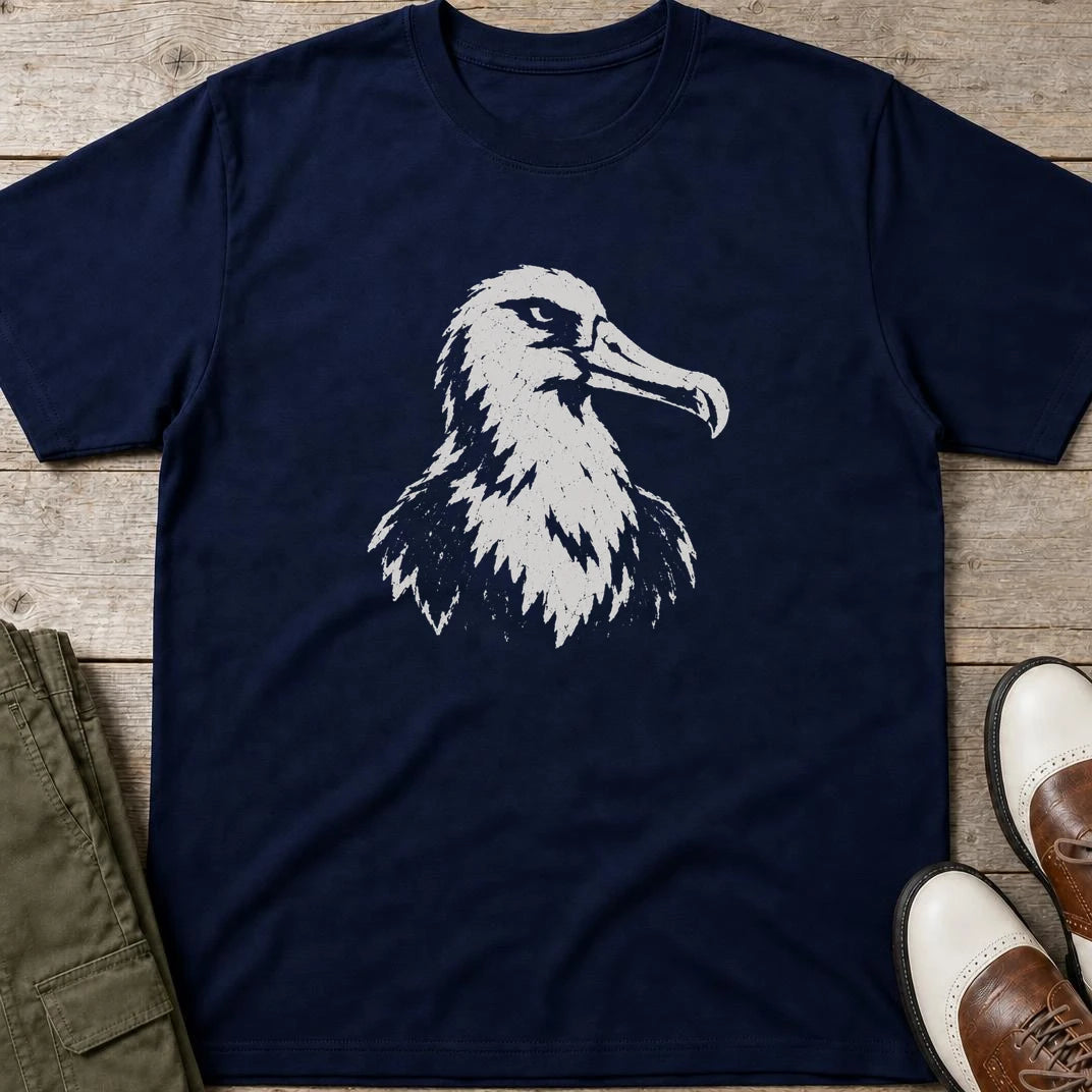 Albatross Block Print T-Shirt in Navy lying on a plain floor. T-shirt is a unisex cut and 100 per cent cotton.