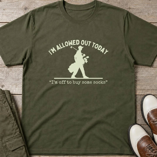 Allowed Out T-Shirt in Military Green lying on a plain floor. T-shirt is a unisex cut and 100 per cent cotton.