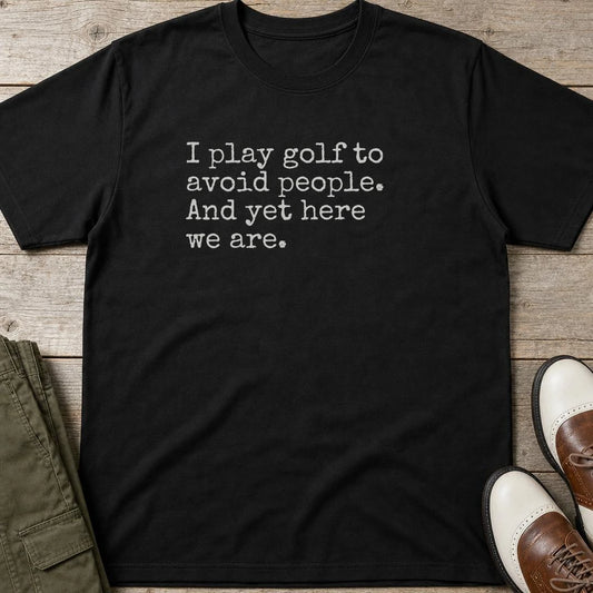 Avoid People T-Shirt in Black lying on a plain floor. T-shirt is a unisex cut and 100 per cent cotton.