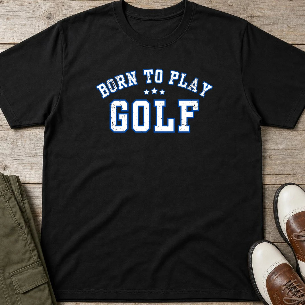 Born To Play Golf T-Shirt in Black lying on a plain floor. T-shirt is a unisex cut and 100 per cent cotton.