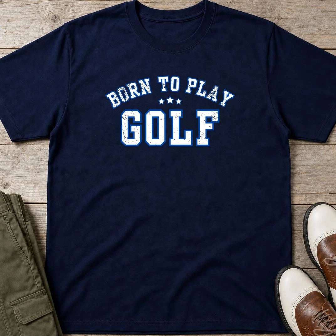 Born To Play Golf T-Shirt in Navy lying on a plain floor. T-shirt is a unisex cut and 100 per cent cotton.