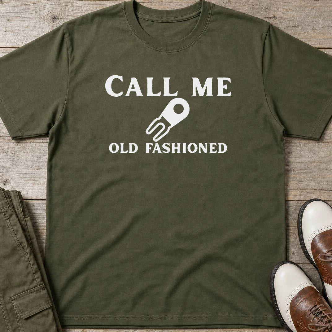 Call Me T-Shirt in Military Green lying on a plain floor. T-shirt is a unisex cut and 100 per cent cotton.