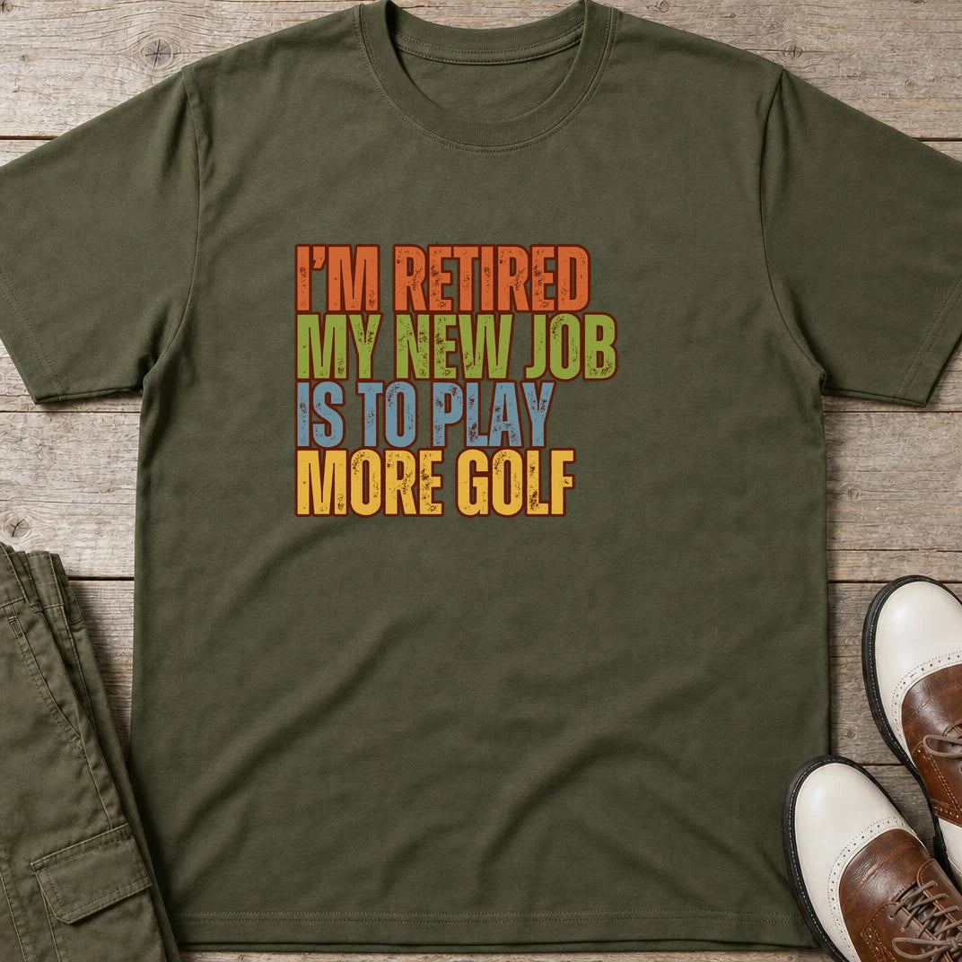 I'm Retired T-Shirt in Military Green lying on a plain floor. T-shirt is a unisex cut and 100 per cent cotton.